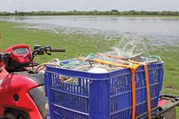Quad bike with gill net on back.